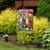 Briarwood Lane Garden Kittens Spring Garden Flag with colorful cats and flowers on display outdoors.