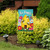 Briarwood Lane Bee Happy Hive small printed garden flag with colorful springtime design on display outdoors.