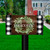 Briarwood Lane Farmhouse Wreath mailbox cover with plaid border and colorful welcome sign on lawn.