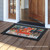 Briarwood Lane Snow Day Gathering indoor/outdoor doormat with winter wildlife scene and decorative border.