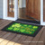 Briarwood Lane Lucky Shamrocks St. Patrick's Day gold four-leaf clover printed decorative doormat for porch display.