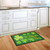 Briarwood Lane Lucky Shamrocks doormat with gold text and four leaf clover on green background.