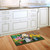 Briarwood Lane small printed Spring Jubilee Floral Doormat on kitchen floor with colorful flowers design.