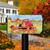 Briarwood Lane Fall Puppies Mailbox Cover with colorful pups, pumpkins, and flowers on a red truck.