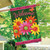 Briarwood Lane Welcome Daisies spring house flag with colorful flowers and cheerful welcome message displayed outdoors.