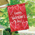 Briarwood Lane String of Hearts Valentine's Day house flag with pink and red hearts decoration.