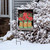 Briarwood Lane Christmas garden flag with poinsettias, cardinals, and joyful holiday flowers design.