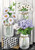 Briarwood Lane Checkered Mason Jars with colorful flowers, lilacs, daisies in decorative printed glass jars.