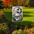 Briarwood Lane garden flag with black and white pumpkins, stripes, and polka dots on a lawn.
