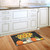 Briarwood Lane small printed doormat with colorful sunflowers, pumpkins, and gourds on a rustic background.