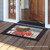 Briarwood Lane festive doormat with red pickup truck and Christmas tree, colorful seasonal porch decor.