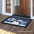 Briarwood Lane Snowman Holiday Cheer Christmas Doormat on a wooden porch with festive winter design.