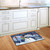 Briarwood Lane Snowman Holiday Cheer Christmas doormat on kitchen floor with festive winter design.