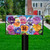 Briarwood Lane Pansies Spring Mailbox Cover with colorful floral design on a black mailbox post outdoors.