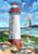 Briarwood Lane Coastal Lighthouse Garden Flag with sailboat, seagulls, and sun by the ocean shore.