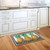 Briarwood Lane small printed pineapple doormat with colorful design on kitchen floor, perfect for springtime.