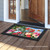 Briarwood Lane Birds And Mailbox Spring Doormat on a porch with colorful, cheery springtime design.