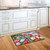 Briarwood Lane Birds And Mailbox Spring Doormat, colorful printed mat with springtime design on kitchen floor.