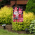 Briarwood Lane Valentine's Gnomes Garden Flag with pink hearts and roses on a colorful decorative banner.