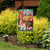 Briarwood Lane Bunnies and Basket Easter Garden Flag with colorful bunnies and eggs on display.