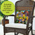 Briarwood Lane small, colorful, printed spring decorative pillow on a wicker chair for springtime outdoor display.
