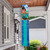Briarwood Lane Farm In Spring colorful windsock hanging from a house porch outdoors.