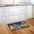 Briarwood Lane Halloween Gnomes Humor Doormat with pumpkins and gnomes on kitchen floor.