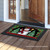 Briarwood Lane small printed Red Checkered Snowman Winter Doormat on wooden porch with festive holiday design.