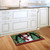 Briarwood Lane Red Checkered Snowman printed doormat on kitchen floor, festive holiday decor for winter season.