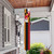 Briarwood Lane Maryland windsock hanging from a porch, evoking a tropical summer scene with humor.