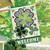 Briarwood Lane Patterned Shamrocks Welcome House Flag with gold accents and plaid details on porch.