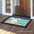 Briarwood Lane Easter Bunny And Chicks Primitive Doormat with colorful flowers, eggs on wooden porch.