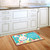 Briarwood Lane Easter Bunny And Chicks Primitive colorful doormat with eggs and flowers on kitchen floor.