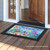 Briarwood Lane With God All Things Are Possible colorful floral doormat with birds at doorway.