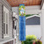 Briarwood Lane Lemon Wreath Spring Windsock with plaid and fruit, hanging on a porch.