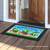 Briarwood Lane Happy Frogs Summer Doormat with colorful frogs, mushrooms, and dragonflies on a bright mat.
