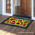 Briarwood Lane Ladybugs And Sunflowers summer doormat with checkered border on a wooden porch floor.