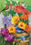 Briarwood Lane Spring Garden Flag with colorful flowers, tulips, and birds on a wooden bucket display.
