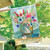 Briarwood Lane coastal flowers summer house flag with colorful floral bouquet, sailboat, and welcome message.