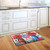 Briarwood Lane Red White And Blue Jars Floral Doormat with flowers and butterflies on kitchen floor.
