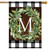Briarwood Lane monogrammed house flag with green wreath on plaid background, colorful decorative seasonal display.