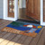 Briarwood Lane Welcome Beach Natural Fiber Coir summer doormat on porch with colorful nautical design.
