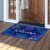 Briarwood Lane Seashells Summer Natural Fiber Coir Doormat on wooden porch with colorful beach design.