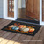 Briarwood Lane Elegant Pumpkins doormat with colorful pumpkins and leaves on a black background.