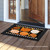 Briarwood Lane Fall Celebration Pumpkins Doormat with orange and white pumpkins on a black background.