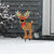 Briarwood Lane Reindeer in Lights Metal Yard Art, brown reindeer with colorful antlers and red bow.