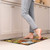 Briarwood Lane Be Grateful Comfort Mat with fall leaves design in a kitchen setting.