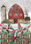 Briarwood Lane Barn in Snow Garden Flag with red barn, holly, and cardinal on picket fence.