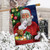 Briarwood Lane Santa's Delivery House Flag with Santa and dog, red and white, Christmas themed.