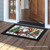 Briarwood Lane Wagon Gnome Doormat with festive gnome and greenery design on wooden porch floor.